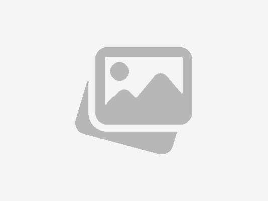 DALL·E 2025-03-27 11.02.18 - A watercolor painting of a European female teacher and a six-year-old student sitting at a desk. The student is cutting out an apple shape from colore